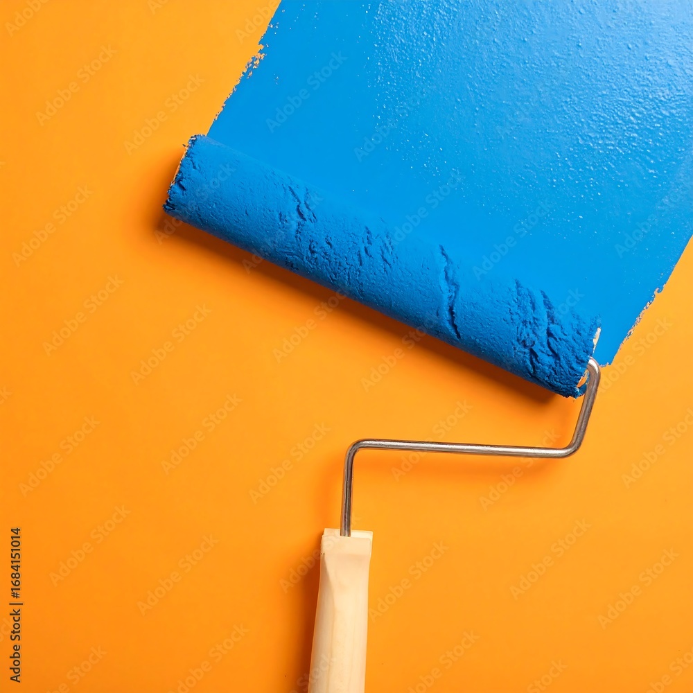 Obraz premium Paint roller on orange wall (1)