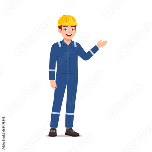 Happy young caucasian construction worker presenting something in blue uniform and yellow helmet