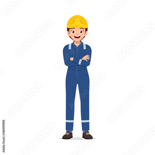 Smiling Female Construction Worker with Arms Crossed Wearing Blue Coverall and Yellow Hard Hat