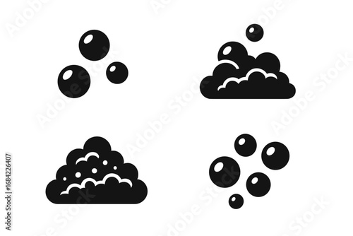 A set of black soap foam and bubbles icons. Vector illustration for cleaning, laundry, and hygiene concepts. Suds, effervescent effect, fizzy drink, or car wash element.