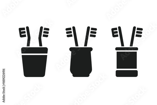 Toothbrush holder glyph icon set. Solid silhouette symbols of toothbrushes in a cup. Oral hygiene, dental care, and bathroom accessories. Vector pictogram illustration.