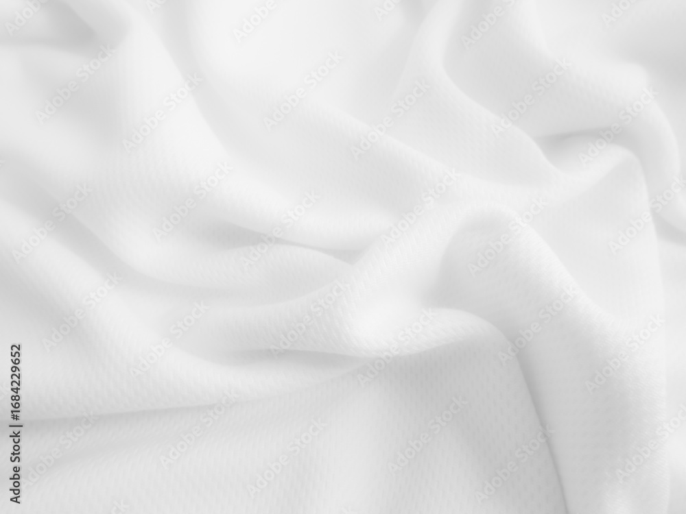 Fototapeta premium White crumpled fabric background. Wavy cloth texture