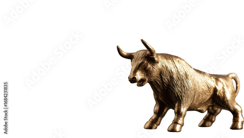 Golden bull statue against black background