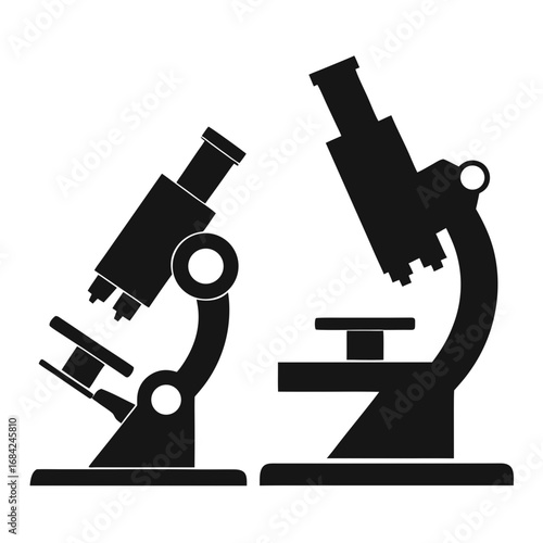 Two black silhouette microscopes on a white background