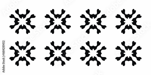 Abstract black and white symmetrical starburst pattern repeated in a grid formation