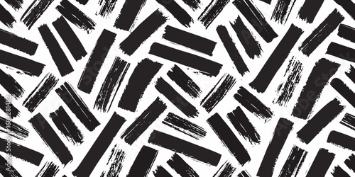 Abstract black brush strokes on a white background seamless pattern for creative design