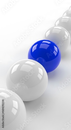 Row of white spheres with one blue sphere in focus balls