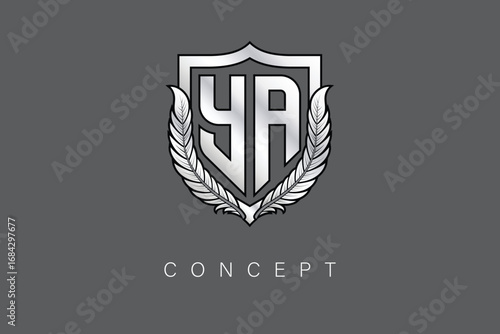 YA Creative Initial Letter Logo with Shield and Laurel Wreath Silver Metallic Branding Emblem on Gray Background.