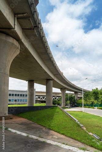 Concrete structure and asphalt road space under the overpass in the city