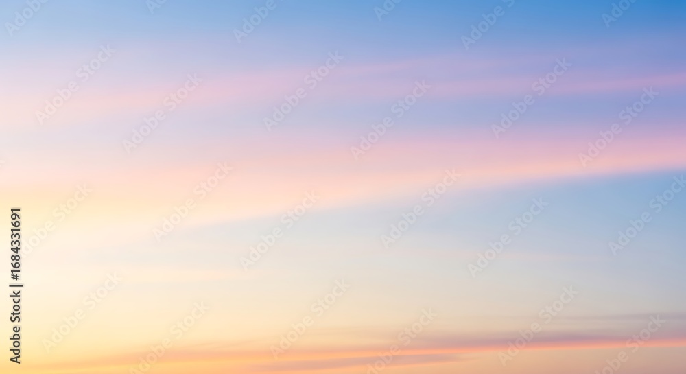 Obraz premium Pastel dreamscape: A serene skyscape of soft pink and pale blue hues evoking tranquility and a sense of limitless