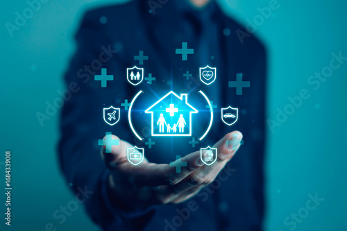Wallpaper Mural Businessman holding digital insurance icon with concept of family protection, health, home, car and travel. Symbolizes safety, security and future financial care. Insurance and protection. Torontodigital.ca