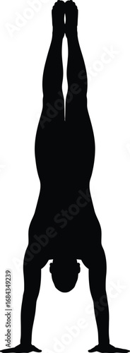 Silhouette of person performing handstand gymnastics