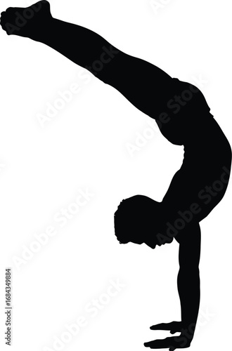 Silhouette of a person performing a handstand gymnastics