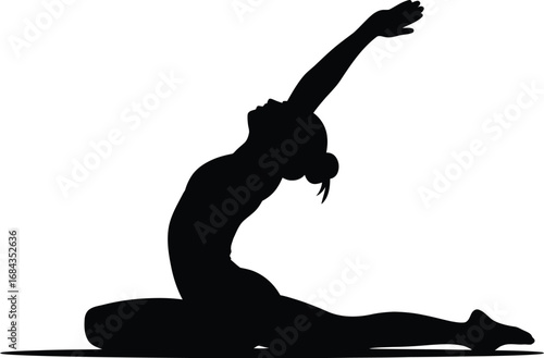 Silhouette of woman in yoga pose stretching flexibility