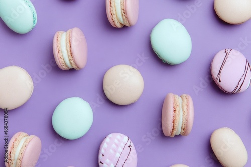 Pastel macarons arranged on a purple background