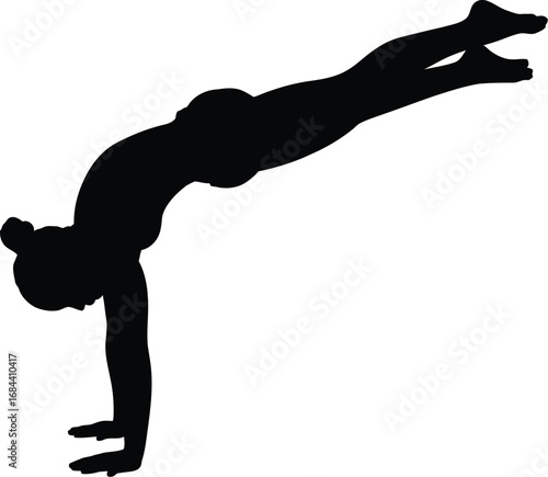 Silhouette of person performing handstand yoga gymnastics