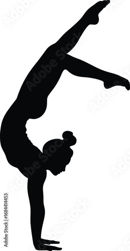Silhouette of gymnast performing handstand split gymnastics