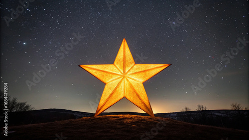 Large illuminated five-pointed star against a starry night sky stars astronomy