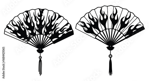 intricate black fans with fiery designs and tassels hanging