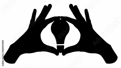 Hands framing a light bulb in silhouette creating a sense of innovation and creative thinking concept