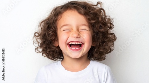 Joyful African American girl smiling at the camera against a close-up portrait young curly