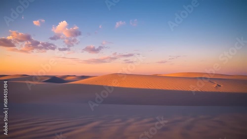 Sunset over undulating sand dunes