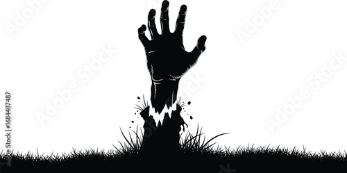 Silhouette of zombie hand rising from ground scary dead mans arm reaching out from grave in graveyard at night