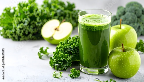 Fresh healthy green juice with kale broccoli and s in a glass on white background for detox and wellness drinks