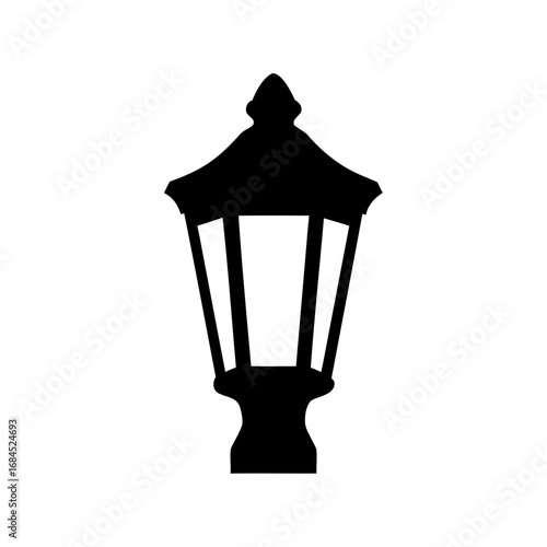 Silhouette of a classic street lamp provides light and vintage charm