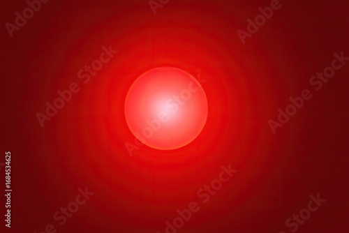 Bright red orb in center, concentric red rings