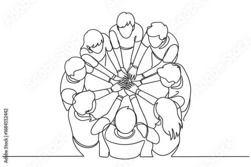 Diverse group of people joining hands in a circle symbolizing unity and teamwork