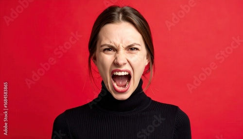 An expressive portrait captures raw emotion, a woman expresses unrestrained rage.