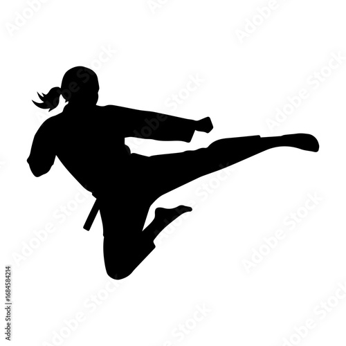 Silhouette of a woman performing a high kick in mid-air