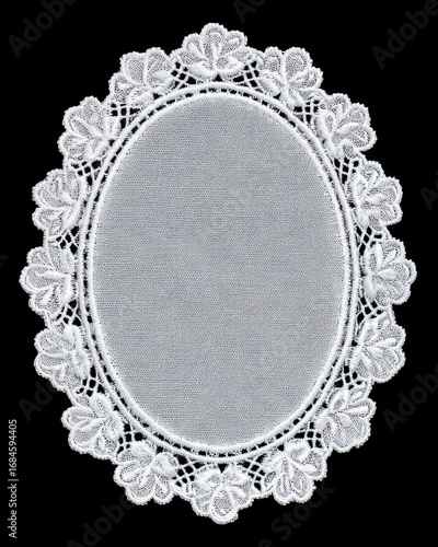 White oval lace doily with delicate elegant floral embroidery on black background