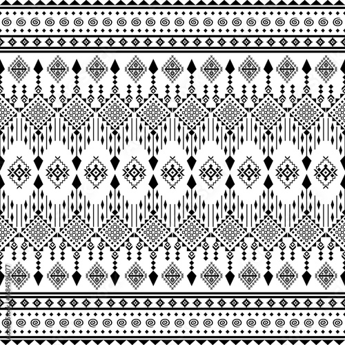 Geometric Elegance: A symmetrical composition in black and white, exhibiting an intricate tribal pattern that embodies simplicity, geometric harmony, and timeless design.