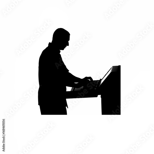 Silhouette of a technician programming a cnc machine panel