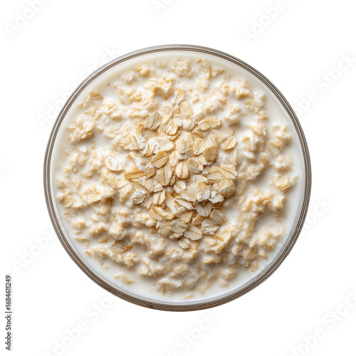 Oatmeal with milk in glass bowl on transparent background
