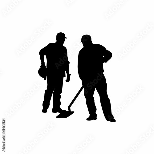 Silhouette of construction workers building a foundation