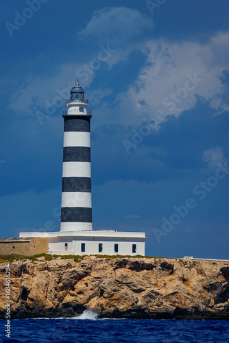 Vertical view of a lighthouse with clouds in the skyIsla del Aire