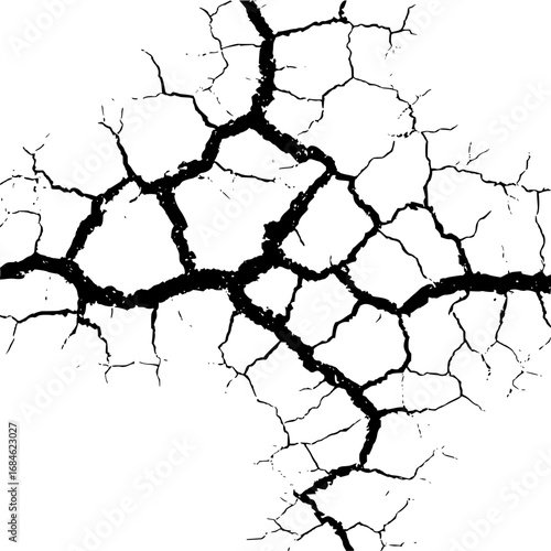 Detailed close up of black cracks forming a network pattern on a white surface creating a unique design