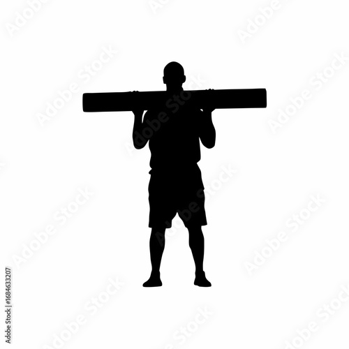 Silhouette of construction worker leveling concrete floor with screed tool