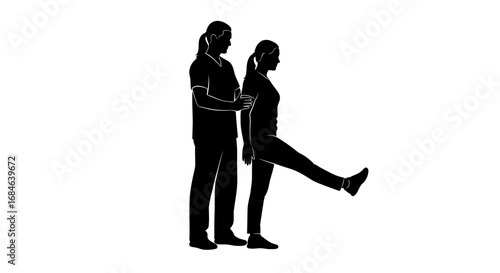 silhouette of physical therapist assisting female patient with leg raise exercise