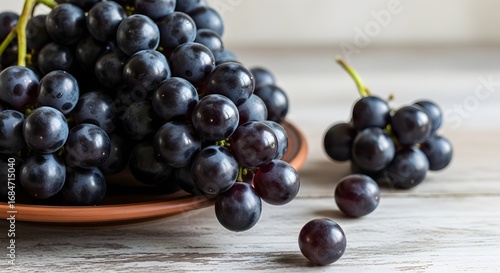 Wallpaper Mural Close-up of dark purple grapes on a rustic wooden table. Torontodigital.ca