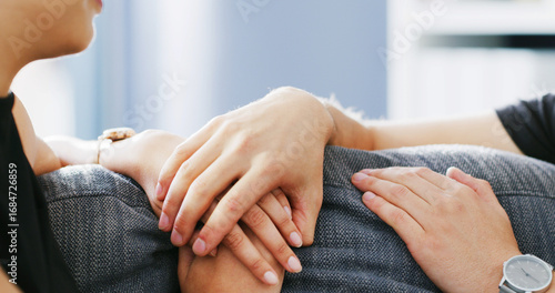 Photos Home, couple and holding hands for care, support and connection with partner for commitment