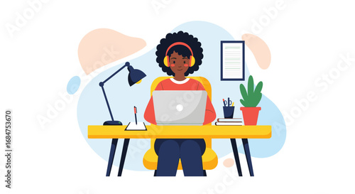 Smiling woman in headphones working remotely on laptop at her desk. Represents online education, freelancing, and digital connectivity.