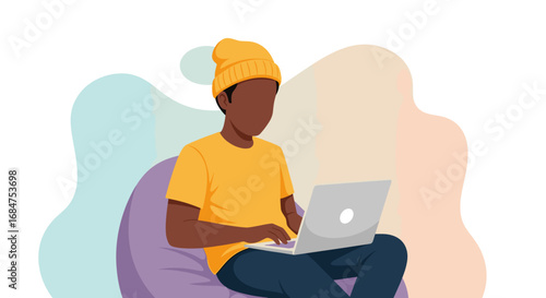 Focused person in a beanie and casual wear using a laptop, ideal for depicting remote work, online learning, freelancing, or digital lifestyle concepts.