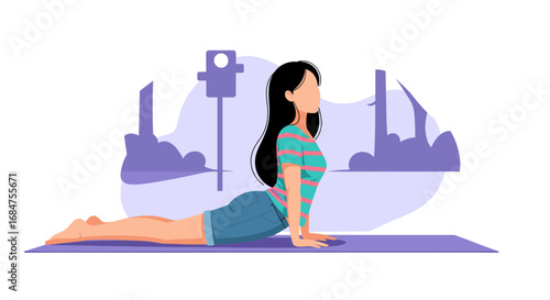 A young woman in a cobra yoga pose on a mat, demonstrating relaxation, fitness, and a healthy lifestyle. Ideal for wellness and exercise concepts.