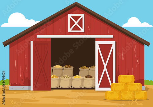 A red barn stands open filled with grain sacks with hay bales stacked outside under a blue sky with clouds