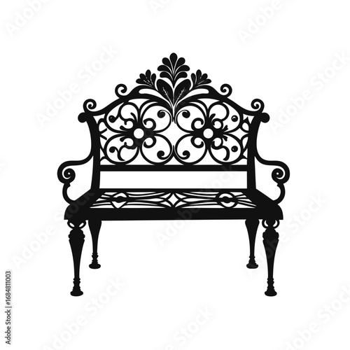 A decorative garden bench, likely made of iron or a similar metal, with an ornate backrest design.