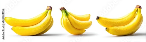 Three bunches of ripe bananas against white background